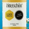 Label of a Bitterschön Lemon Spritz bottle, featuring "Natural Ingredients" and "Alcohol-Free Drink" on a blue floral background.